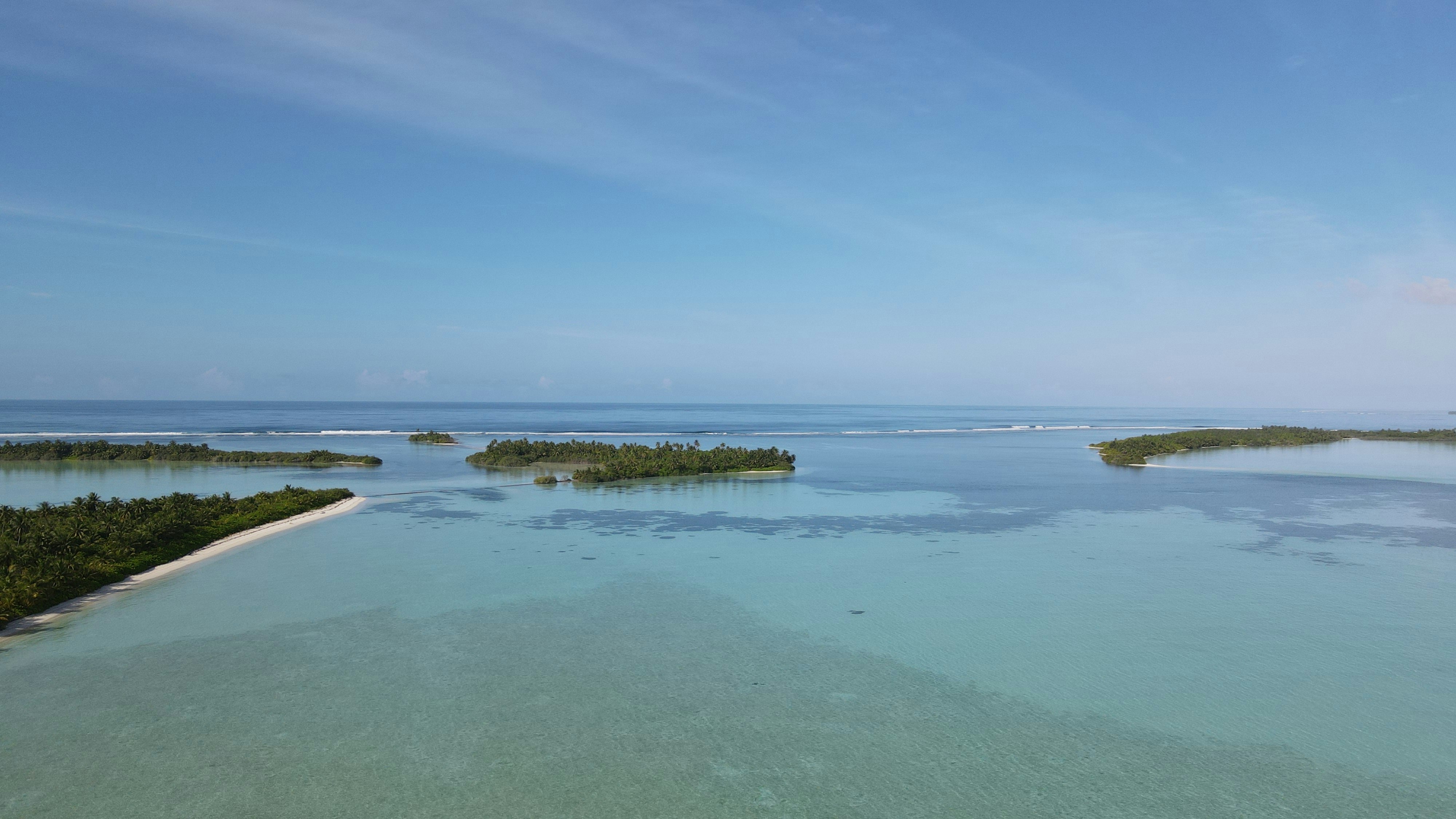 body of water under blue sky during daytime